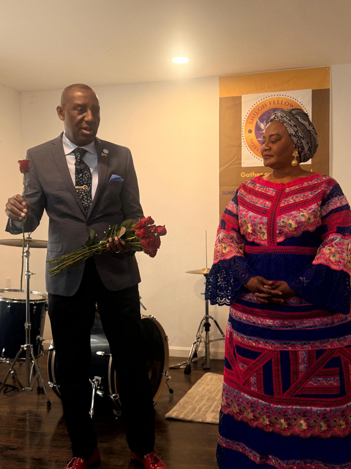 Pastor Jean-Serge Dekenty with members at a Shiloh Fellowship event